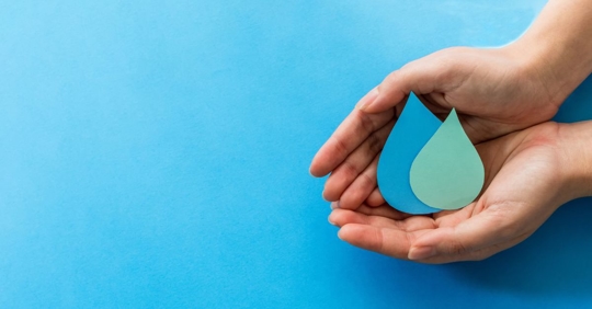 hands holding water drop