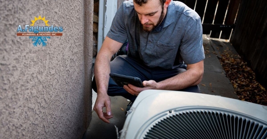Man repairing an air conditioner.