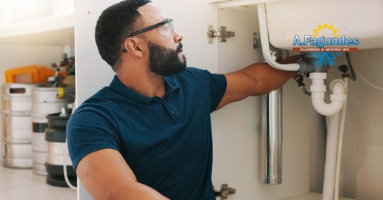 Man repairing air conditioner.