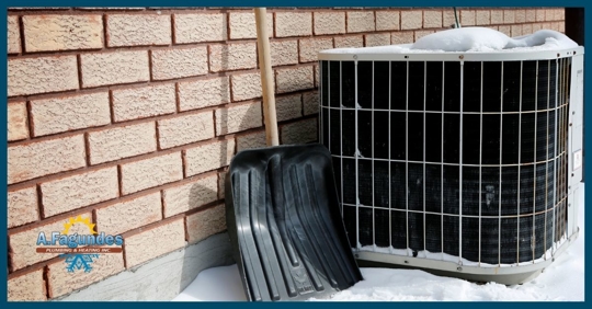 HVAC unit in the snow.