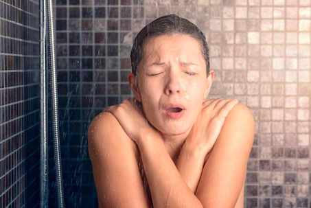 woman cold shower